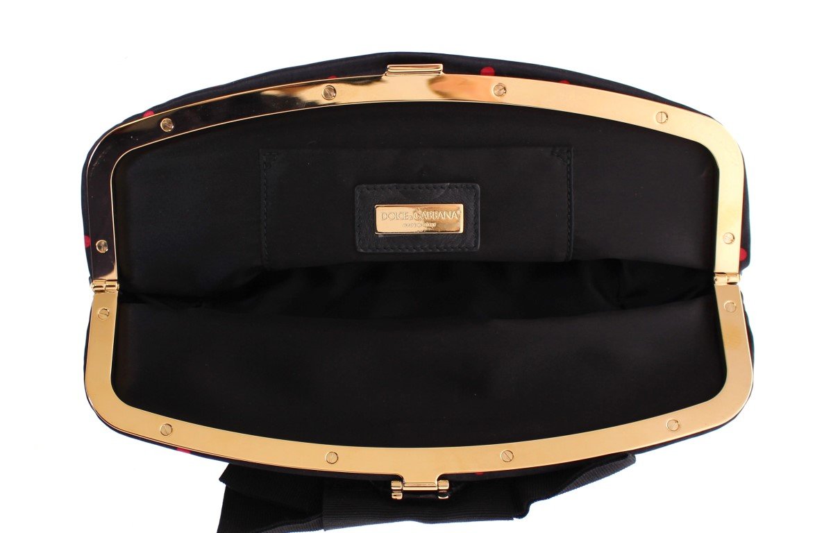 Black polka dotted silk clutch
